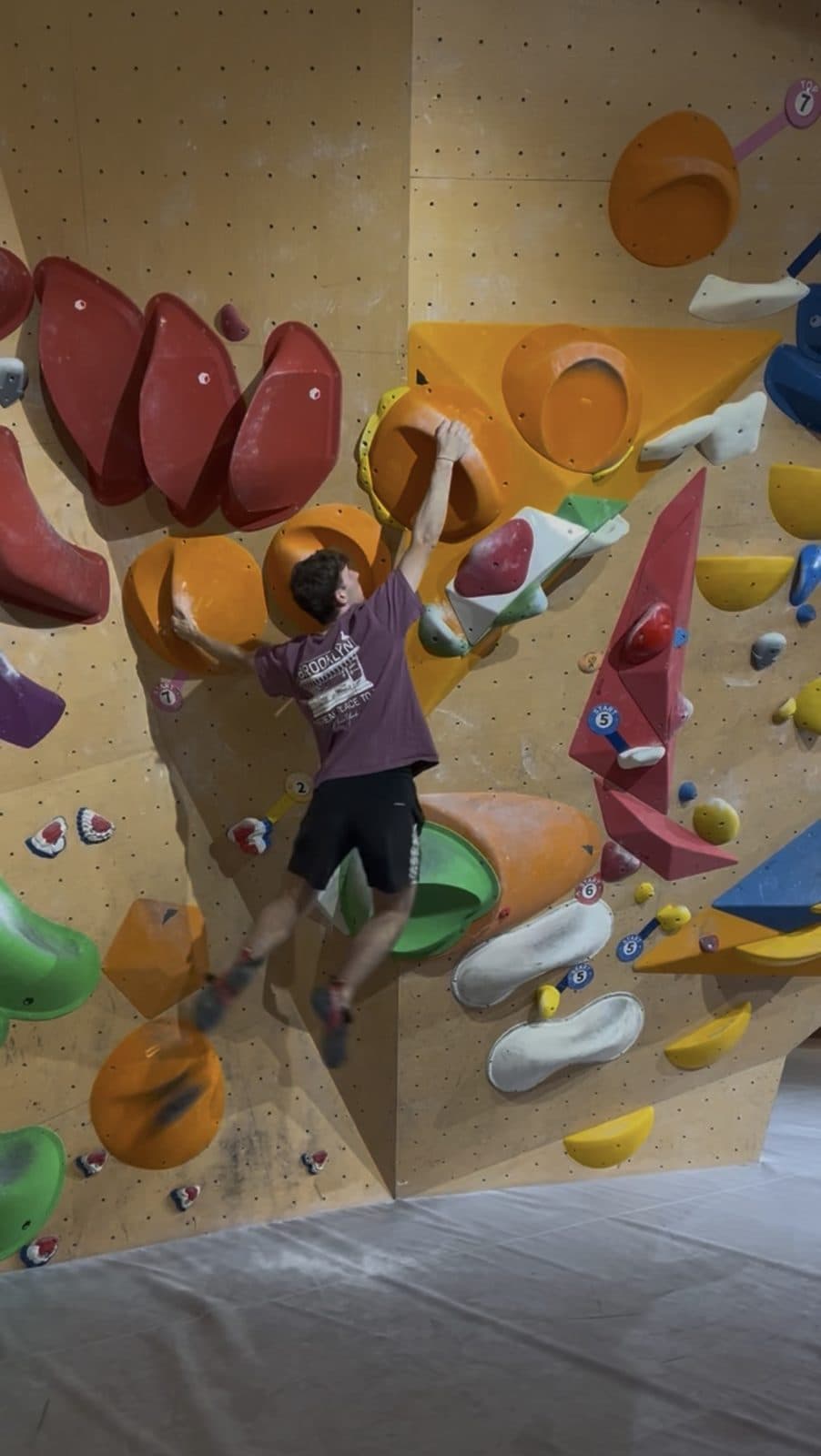 Quentin on a bouldering wall