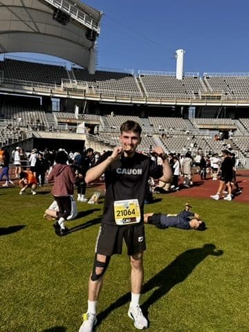 Quentin with his finisher medal after a half-marathon